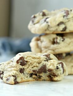 three chocolate chip cookies stacked on top of each other