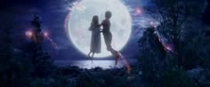 two people standing in front of a full moon with their arms around each other as if they are kissing