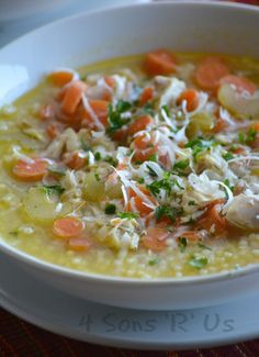 a white bowl filled with soup on top of a table