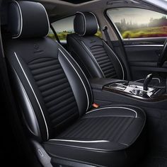 the interior of a modern car with black leather and white stitching on the seats