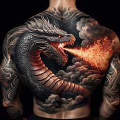 a man with tattoos on his back holding a fire breathing dragon