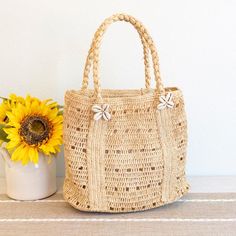 IN STOCK FAST SHIPPING FROM LOS ANGELES Add some coastal charm to your summer look with Elena Handbags Raffia Beach Bag. This shoulder bag is made from natural raffia, complete with a playful shell decoration. Perfect for a day at the beach or a casual outing, it's the must-have accessory for any summer adventure! Natural Soft Raffia Straw Handmade Size: 11"H x 13"W x 6"D Strap drop length: 7" Designer Style ID: 8706 Natural Braided Bucket Bag For Daily Use, Natural Beachy Beach Bag For Everyday Use, Natural Palm Leaf Beach Bag For Travel, Rectangular Natural Bucket Bag For Vacation, Natural Braided Everyday Bucket Bag, Braided Natural Bucket Bag For Everyday Use, Everyday Natural Braided Bucket Bag, Beachy Natural Straw Bag Rectangular, Natural Braided Bucket Bag For Everyday Use