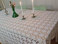 a table with two candles on top of it