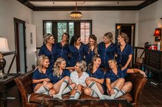 a group of women sitting on top of a couch