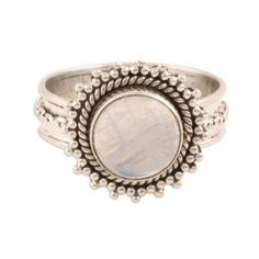 Elusive glimmers of color flash from a rainbow moonstone cabochon on this ring from Rakesh Rana in India. The stone is set in sterling silver on a band that is circled by a slender chain. The ring's bezel is elaborated with silver granules and a rope motif. Silver Bohemian Moonstone Ring, Silver Oval Moon Phase Ring, Silver Oval Ring With Moon Phase, Silver Oval Rings With Moon Phase, Adjustable Moonstone Jewelry With Round Stone, Bohemian Jewelry With Bezel Setting In Round Shape, Bohemian Round Jewelry With Bezel Setting, Bohemian Round Bezel Set Jewelry, Adjustable Oval Cabochon Moonstone Ring