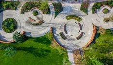 an aerial view of the word zoo spelled out in concrete and surrounded by green grass