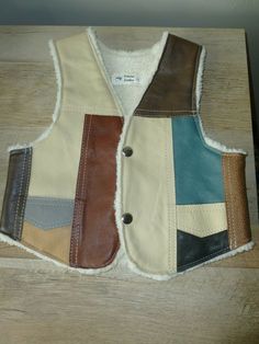 Kids genuine leather vest lined with fleece. 2 Snap buttons Approx size: 14 inch top to bottom 12 inch under arms width 9 inch top of shoulder width New Free Shipping! Multicolor Leather Outerwear For Fall, Multicolor Leather Winter Outerwear, Faire Outfit, Ren Faire Outfits, Vest Pattern Free, Denim Ideas, Vest Pattern, Fleece Vest, Leather Vest