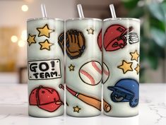 three tumbles with baseball themed designs on them