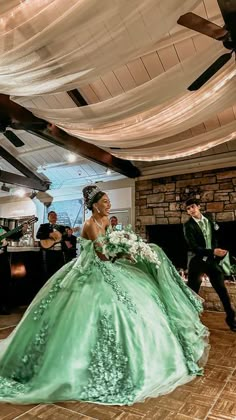 a bride and groom are dancing together on the dance floor