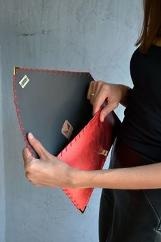 Red Metallic Symmetria Clutch. The perfect bag for all occasions! Ideal for cocktail and parties, weddings and more. This adorable clutch is handmade out of a genuine, lux Italian red metallic cow leather. It fits all your essentials, wallet, keys, mobile, cosmetics etc. It is hand stitched with red waxed thread. The interior is fully lined with dark gray leatherette. I use leatherette for the interior because it can easily be cleaned with a slightly damp sponge. The clutch closes with a metal t Designer Leather Clutch For Party, Luxury Red Clutch For Evening, Red Pouch Clutch For Evening, Red Pouch Clutch For Party, Red Leather Clutch Evening Bag, Red Leather Clutch For Party, Red Leather Evening Clutch Bag, Red Leather Evening Bag, Modern Leather Evening Bag For Party