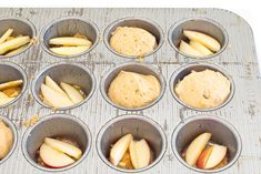 muffin tins filled with apple slices and peanut butter