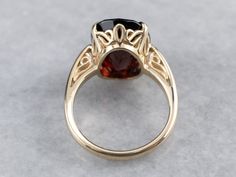 This beautifully structured, classic mounting holds a bold stone! This gem is a gorgeous deep red garnet, weighing in at over 11 carats. Garnets are known for their exceptional color and play of light, and this gem is opulent and sophisticated. Metal: 14K Yellow Gold Gem: Garnet 11.43 Carats Gem Measurements: 11 x 15 mm, Oval Ring Size: 6 Marks: "14K" Stamped on the inside band Luxury Solitaire Ruby Ring For Formal Events, Luxury Solitaire Ruby Ring For Formal Occasions, Formal Garnet Ring With Polished Finish, Large Garnet Ring, Ornate Garnet Round Rings, Luxury Garnet Jewelry With Polished Finish, Faceted Garnet Jewelry In Yellow Gold, Luxury Antique Garnet Rings, Pyrope Garnet