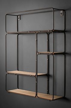 a metal shelf with two wooden shelves on it and some hooks hanging from the wall