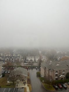 an aerial view of a city in the fog