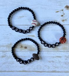 Perfect gift for your little sports fan! This listing is for one (1) bracelet.  Beads are matte black and are 4mm. Bracelet sizing chart is just a general guide.  Since wrist size varies greatly from person to person, please measure your wrist and add half (.5) an inch to get the best fit. ✨Jewelry Care✨ 💜 Avoid contact with water, perfumes, lotions and chemicals 💙 Roll bracelet on and off wrist to avoid overstretching. 💛 Do not drop your bracelets on hard surfaces. 💚 Store in a cool, dry pl Soccer Bracelet For Boys, Cheap Adjustable Bracelets For Football Season, Sports Bracelets Diy, Personalized Black Beaded Bracelets For Father's Day, Personalized Black Jewelry For Birthday, Customized Black Jewelry For Personalized Gift, Casual Personalized Jewelry For Father's Day, Casual Black Jewelry For Personalized Gifts, Adjustable Black Team Spirit Jewelry