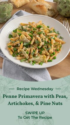 a white plate topped with pasta and peas