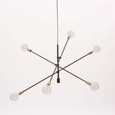 a chandelier with five lights hanging from it's center and four bulbs on each end