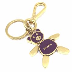 Used Prada Prada Bear Keychain Bag Charm Gp Gold Accessory Key Ring Ladies Men's Unisex (Sku: Gzl11qlr) === General === Brand : Prada === Design === Type : Keyring Gender : Men,Women Color : Gold Material : Gold Plating === Size === Size (Hxwxd) : 10cm X 4.5cm X 5.00mm / 3.93'' X 1.77'' X 0.19'' === Included Items === Accessories : None Accessories Notice : Before Purchasing, Please Refer To The Images Of The Accessories Included With The Item. === Condition === Condition : Used (Very Good) Rank Bear Keychain, Vegetable Leather, Keychain Bag, Macrame Bag, Gold Accessories, Vintage Cartier Bracelet, Dior Ring, Large Tote, Prada Bag