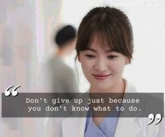 a woman in a white lab coat smiles at the camera with a quote above her that says, don't give up just because you don't know what to do