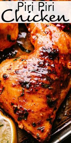 a close up of chicken on a pan with lemons