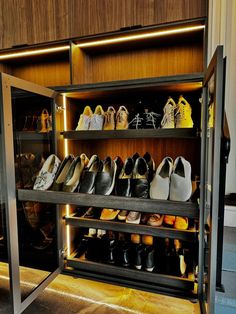 there are many pairs of shoes on the shelves