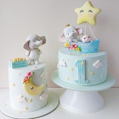 two cakes decorated with elephants and stars