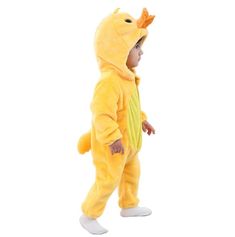 a little boy in a yellow dinosaur costume