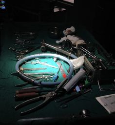 an assortment of tools are laying out on a table