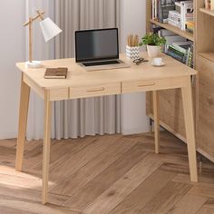 a laptop computer sitting on top of a wooden desk in front of a book shelf