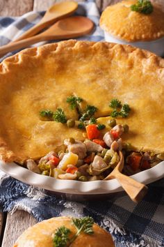 there is a pie with vegetables in it on the table