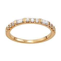 a yellow gold ring with three baguettes on the side and two rows of diamonds