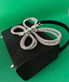 A glamor bag that incorporates elegance and glamour to add subtle sparkle to any outfit. The black satin finish is the perfect summer shade to complement an evening seaside cocktail and its petite size makes it an ideal companion for any occasion. Perfectly fits in your phone and other items. Dimensions: 16cm x 12cm x 7cm Estimated Delivery: 3-5 Days Butterfly Bag, Butterfly Bags, Interior Fabric, Box Bag, Petite Size, Pink Bag, Black Satin, Perfect Summer, Satin Finish