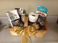 a starbucks gift basket with coffee, cookies and other items