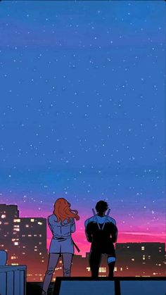 two people standing on top of a roof looking up at the stars in the sky