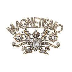 The Gucci Magnetismo Crystal Brooch In Gold Is A Shining, Sophisticated Brooch Crafted In Italy Of Aged Gold-Tone Metal. This Crystal Encrusted Brooch Features The Word "Magnetismo" On Top Of A Swirling Flower Design. The Back Includes Delicate Line Work And A Pin Style Closure. Gold Magnetismo Crystal Brooch 100% Gold-Tone Metal Brooch, Pin "Magnetismo" Flower Design Line Work And Gucci Logo On Back Pin Style Closure 3" X 2.75" Product Number 525214 Made In Italy Gucci Jewelry, Line Work, Gucci Fashion, Heart Brooch, Crystal Brooch, Star Charms, Gold Tone Metal, Flower Design, The Collection