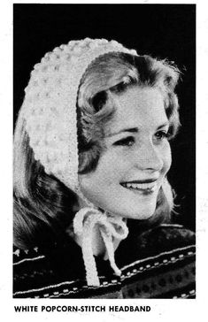 an old black and white photo of a woman wearing a knitted beanie hat