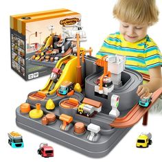 a young boy playing with a toy set