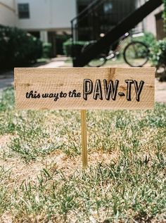 a wooden sign that says, this way to the pavly in black ink