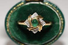 OLD VINTAGE 18K GOLD NATURAL DIAMOND AND CABOCHON EMERALD DECORATED RING In very good condition. Total weight 3 grams. Totally about 0.04 ct diamond. The diamond has vs clarity and H color. Totally 0.25 ct Emerald. Ring size is US 7.4. We can make any size.(We offer free resizing). Original vintage item about 50 years old. Please contact for any questions. Vintage Gold Emerald Anniversary Ring, Gold Estate Rings For Formal Occasions, Vintage Hallmarked Emerald Ring For Formal Occasions, Vintage Yellow Gold Emerald Ring, Vintage Yellow Gold Emerald Ring For Formal Events, Vintage Emerald Ring Stamped 14k For Formal Occasions, Vintage Yellow Gold Emerald Ring For Formal Occasions, Estate Gold Ring As Gift, Vintage Hallmarked Emerald Ring For Anniversary