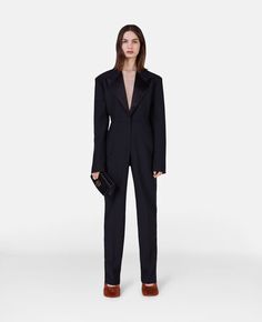 Luxury Long Sleeve Formal Pantsuit, Evening Pantsuit With Notch Lapel And Pressed Crease, Formal Tuxedo Pantsuit With Lapel Collar, Luxury Lapel Collar Semi-formal Pantsuit, Luxury Semi-formal Pantsuit With Lapel Collar, Formal Long Sleeve Pantsuit With Structured Boning, Evening Tailored Pantsuit With Structured Boning, Sleek Fitted Pantsuit With Structured Boning, Tuxedo Pantsuit With Hidden Button Closure