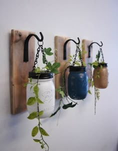 three mason jars are hanging on a wall with plants in them and the text reads recycle those used glass jars jars with these thrift