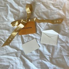 All Orders Ship Next Business Day! Authentic Louis Vuitton Gift Wrapping Ribbon + Gift Card This Is 100% Authentic - Check Out My Luxury Handbag Tiktok: @Lizherrling Condition: Brand New/No Holes/No Stains/No Pilling/No Fade Some Creases On Ribbon Color Is Gold Size Of Card Length 3 1/4 In Width 2 1/2 In Measurements Are Approximate Perfect For Gift Wrapping Happy To Include This For Free With A Purchase Of Any Of My Luxury Handbags Smoke Free Home! Offers Welcome Louis Vuitton Gift, Louis Vuitton Orange, Wrapping Ribbon, Louis Vuitton Gifts, Ribbon Gift, Ribbon Colors, Orange Gold, Authentic Louis Vuitton, Luxury Handbags