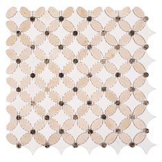 the back side of a white and brown tile with circles on it, all in different sizes