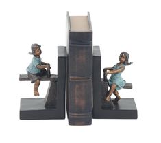 two bookends with figurines sitting on top of them