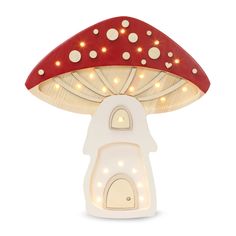 a mushroom shaped lamp with lights on it