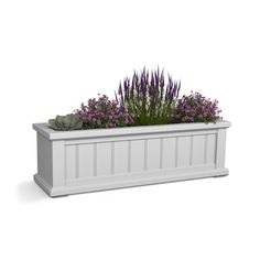 a white planter filled with purple flowers and greenery