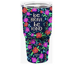 the be brave, be kind tumbler cup is shown with flowers and words on it