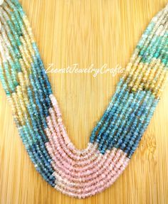 multicolored seed beaded necklace on wooden table