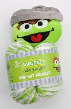 sesame street lion brand one hat wonder yarn ball with character face on the front and bottom