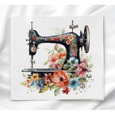 an old sewing machine with flowers painted on it